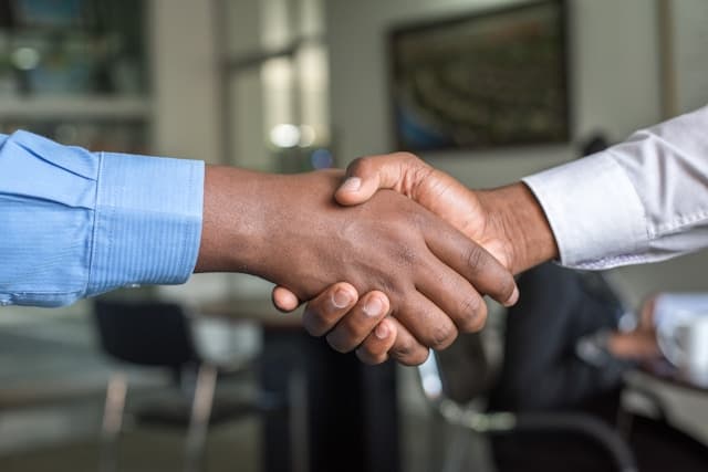 Handshake representing JS Engineering client partnership and integrated technical support